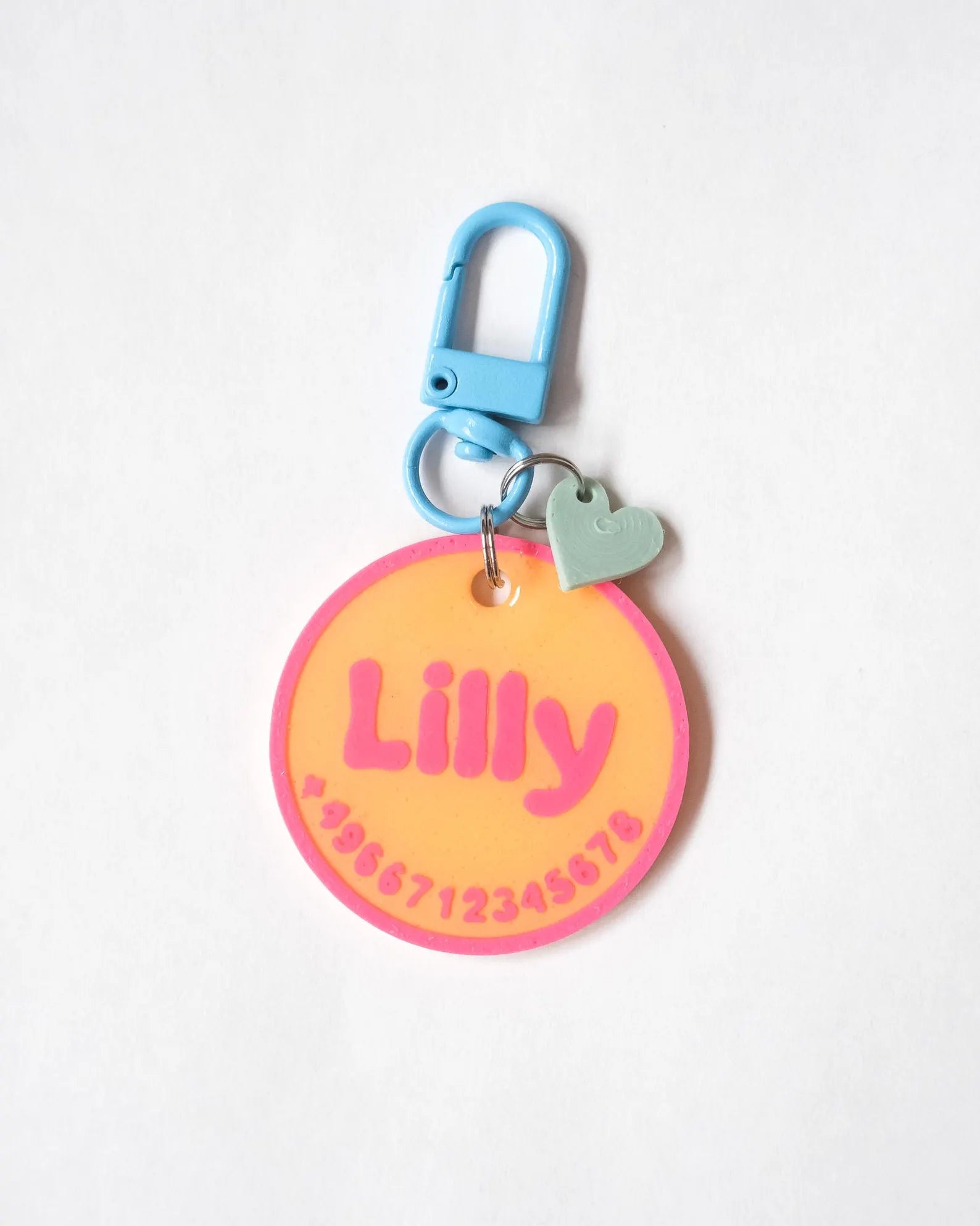 Lilly - Neon orange tag with hot pink and blue carabiner
