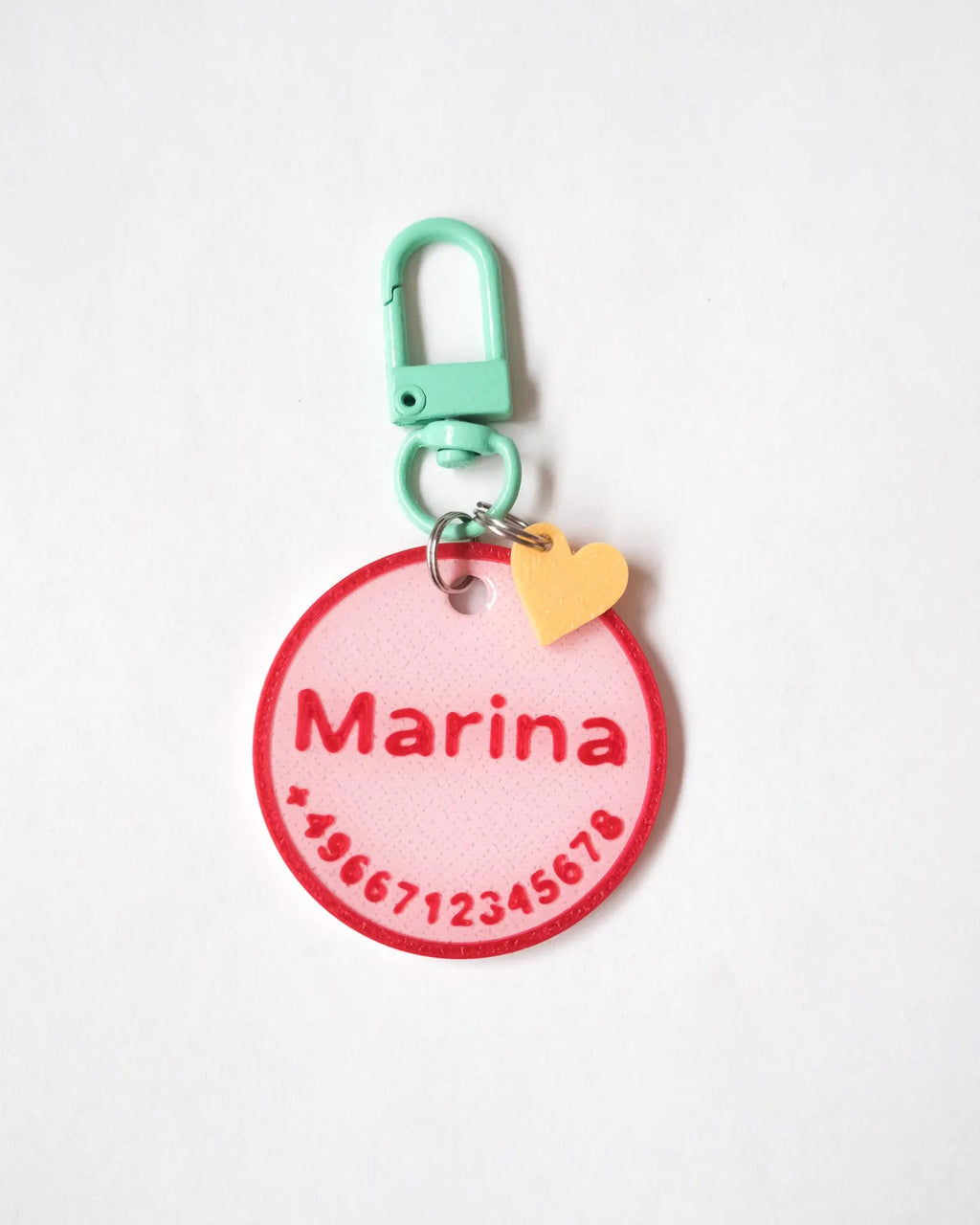 Marina - Pink tag with red outline and mint carabiner